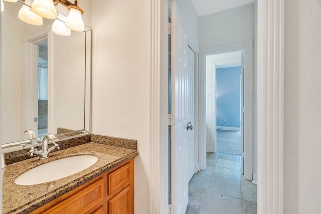 bathroom featuring vanity and baseboards