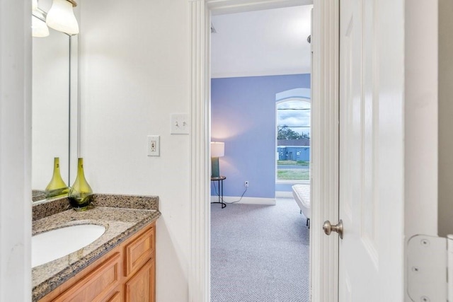 bathroom featuring vanity and baseboards