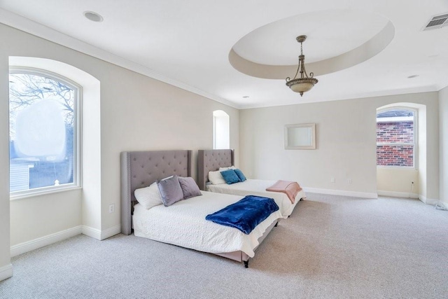 bedroom with carpet floors, baseboards, visible vents, and crown molding