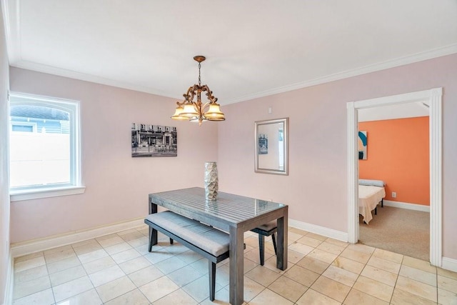 dining room with light tile patterned floors, baseboards, ornamental molding, and a notable chandelier