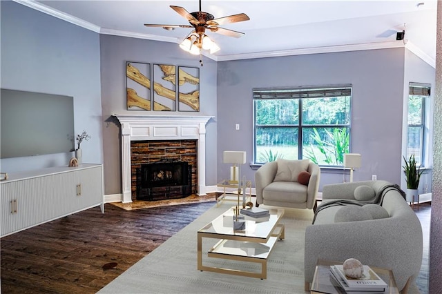 living area featuring ornamental molding, ceiling fan, wood finished floors, and a healthy amount of sunlight