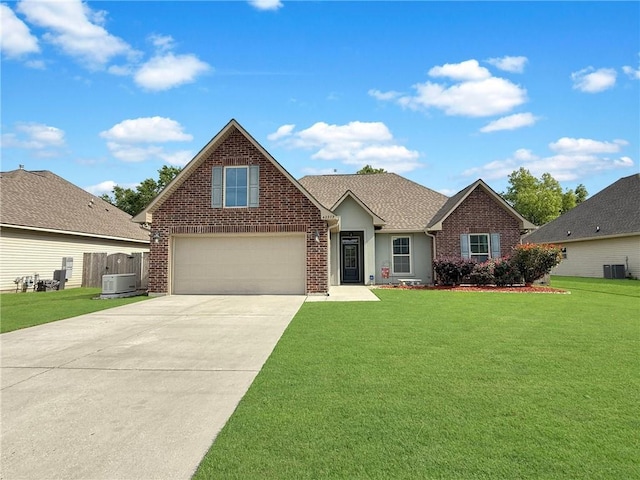 42273 Atmore Pl, Ponchatoula, LA 70454 - view of front of house featuring brick siding, driveway, a front yard, and cooling unit