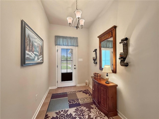 42273 Atmore Pl, Ponchatoula, LA 70454 - entryway with baseboards, tile patterned flooring, and a notable chandelier