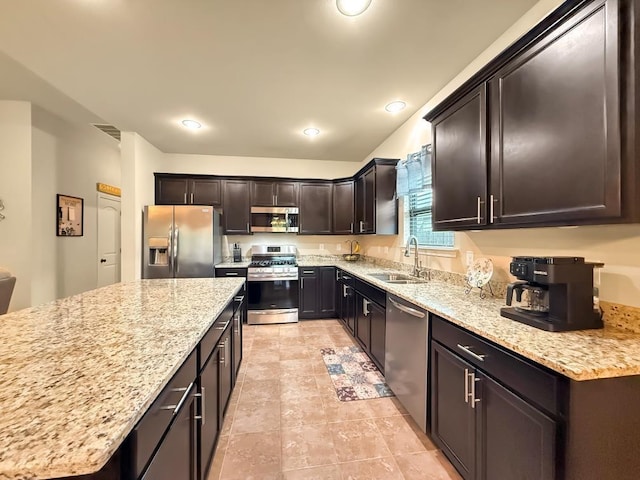 42273 Atmore Pl, Ponchatoula, LA 70454 - kitchen with light stone counters, a sink, visible vents, and stainless steel appliances