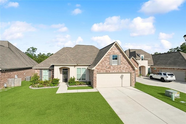 french country style house with a shingled roof, brick siding, a garage, a front yard, and concrete driveway