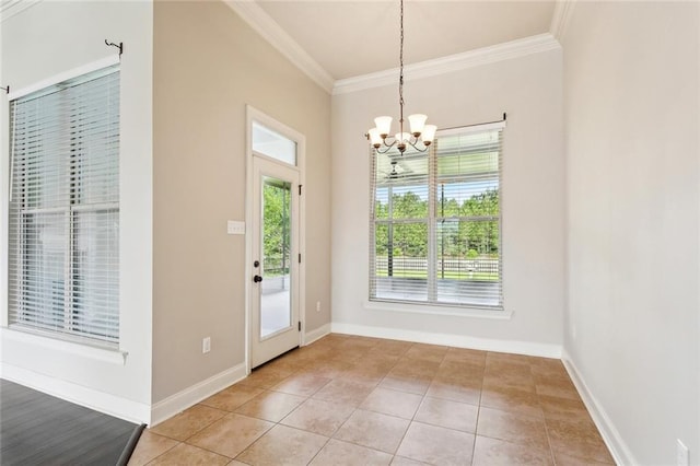 entryway with crown molding, light tile patterned floors, baseboards, and a chandelier