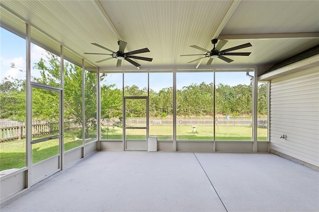 unfurnished sunroom with a ceiling fan