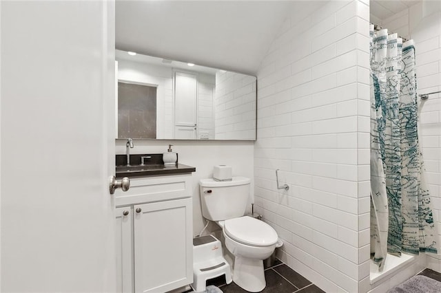 bathroom with vanity, tile patterned floors, a shower stall, and toilet