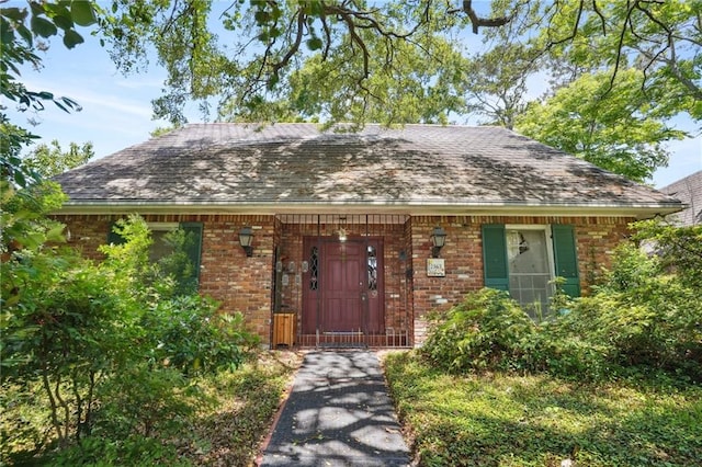 2363 Lark St, New Orleans, LA 70122 - view of front of property with brick siding and a shingled roof