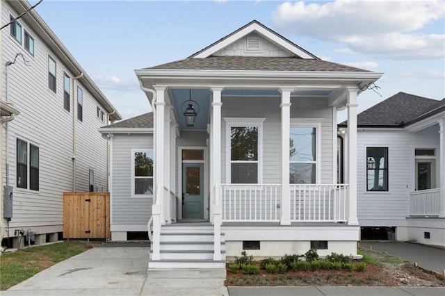 537 Thayer St, New Orleans, LA 70114 - shotgun-style home featuring a porch and a shingled roof