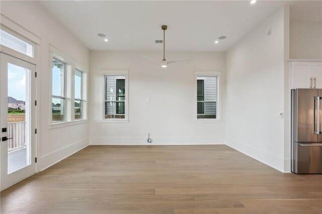 537 Thayer St, New Orleans, LA 70114 - unfurnished dining area with recessed lighting, baseboards, and light wood-style flooring