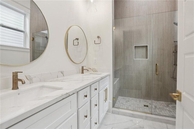 537 Thayer St, New Orleans, LA 70114 - bathroom featuring double vanity, a sink, marble finish floor, and a shower stall