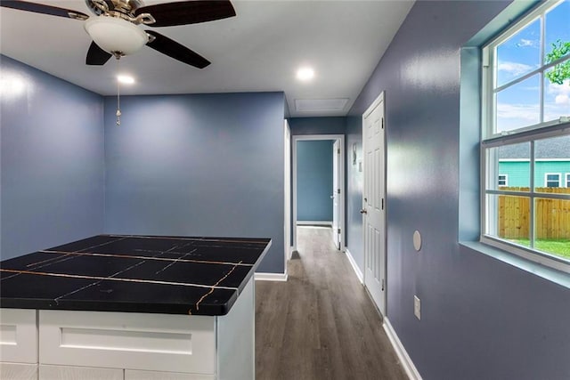 corridor featuring recessed lighting, baseboards, attic access, and dark wood-style floors