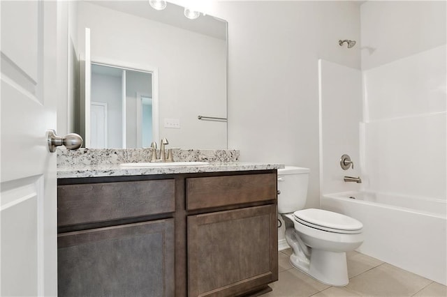 full bath featuring tile patterned floors, toilet, bathing tub / shower combination, and vanity