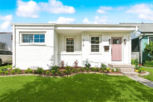 316 Claiborne Ct, Jefferson, LA 70121 - view of front of house featuring brick siding and a front yard