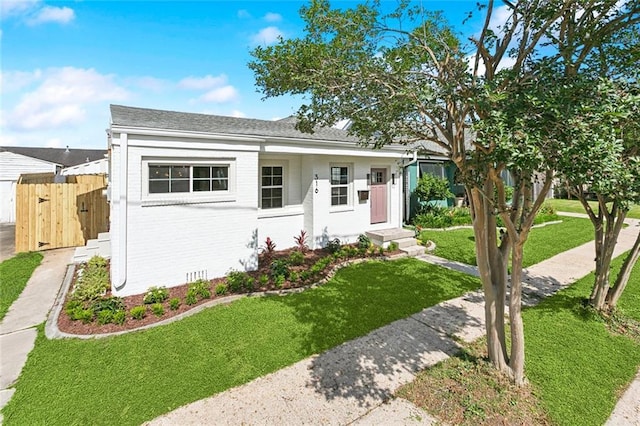 316 Claiborne Ct, Jefferson, LA 70121 - bungalow-style house featuring brick siding, fence, a gate, and a front yard