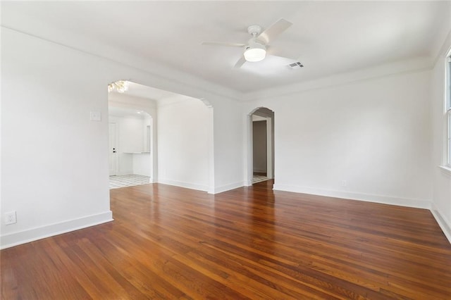 316 Claiborne Ct, Jefferson, LA 70121 - spare room with a ceiling fan, visible vents, arched walkways, wood finished floors, and baseboards