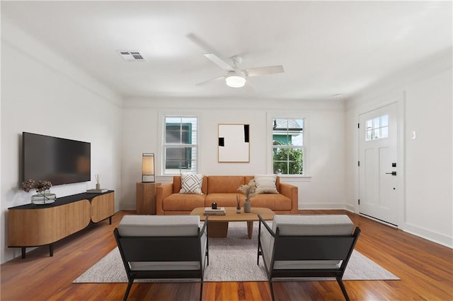 316 Claiborne Ct, Jefferson, LA 70121 - living area featuring visible vents, a ceiling fan, baseboards, and wood finished floors
