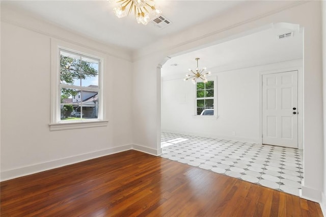 316 Claiborne Ct, Jefferson, LA 70121 - unfurnished room with visible vents, baseboards, a notable chandelier, and a wealth of natural light