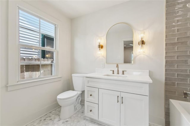 316 Claiborne Ct, Jefferson, LA 70121 - bathroom featuring baseboards, a bathing tub, toilet, and vanity
