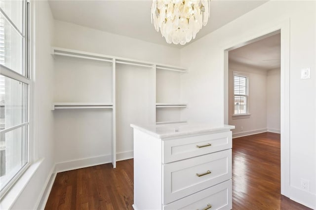 316 Claiborne Ct, Jefferson, LA 70121 - walk in closet with an inviting chandelier and dark wood-type flooring