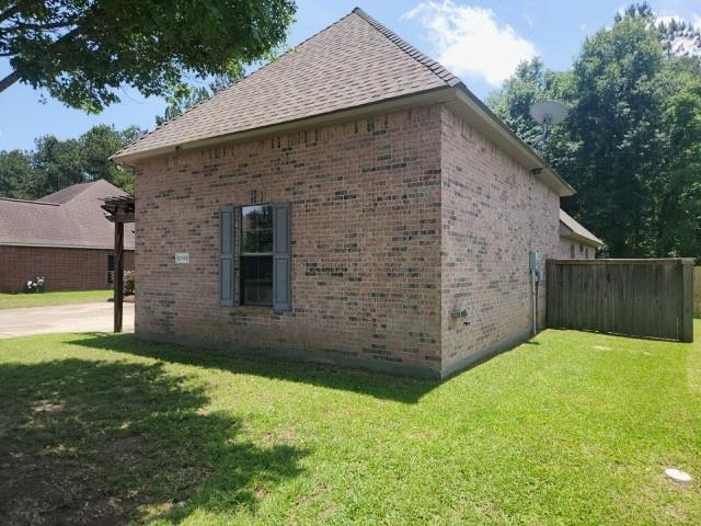 12742 Diamond Lake Dr, Walker, LA 70785 - view of side of home with brick siding and roof with shingles