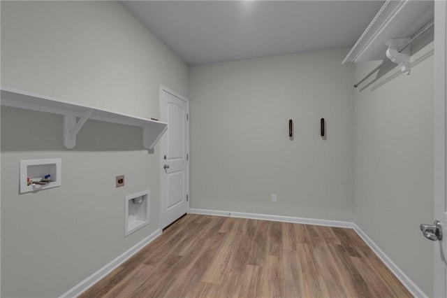 laundry area featuring wood finished floors, hookup for an electric dryer, washer hookup, and baseboards