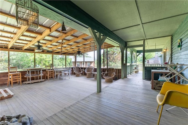 wooden terrace featuring outdoor dining area