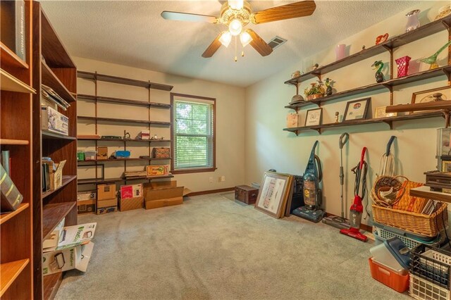 storage room with ceiling fan and visible vents