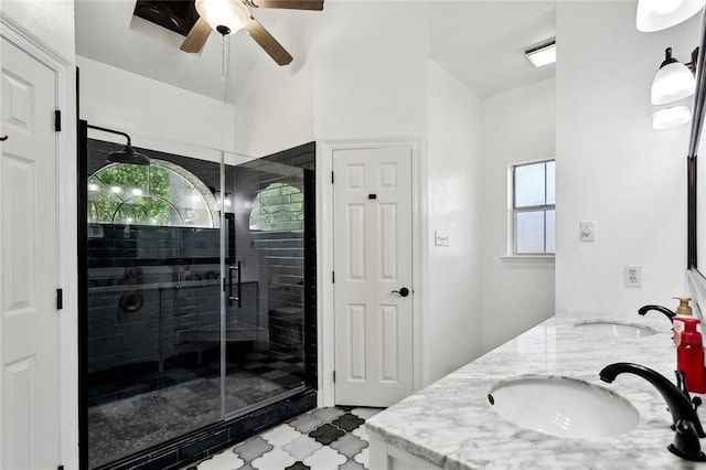 6024 Chateau Loire Cir, Mandeville, LA 70448 - full bath featuring double vanity, ceiling fan, a shower stall, and a sink