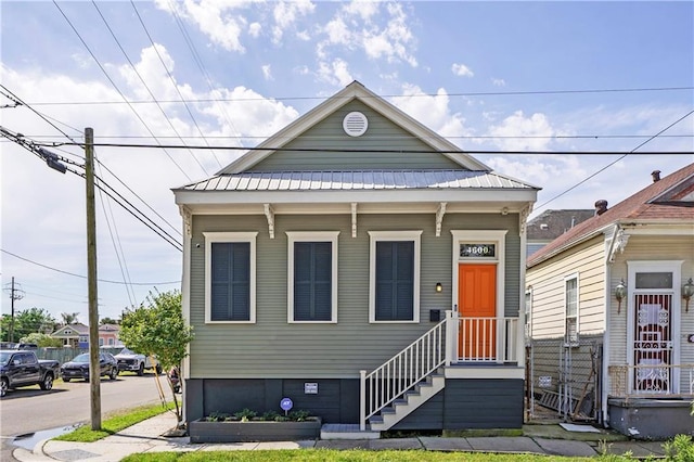 view of front of property featuring metal roof