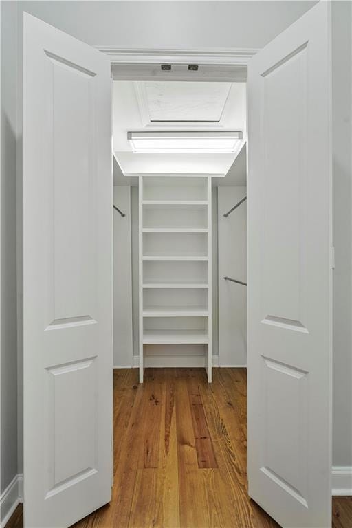 spacious closet with wood finished floors