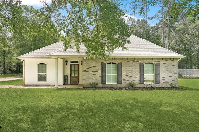 23284 Burvant St, Abita Springs, LA 70420 - view of front of home with a front yard and a shingled roof