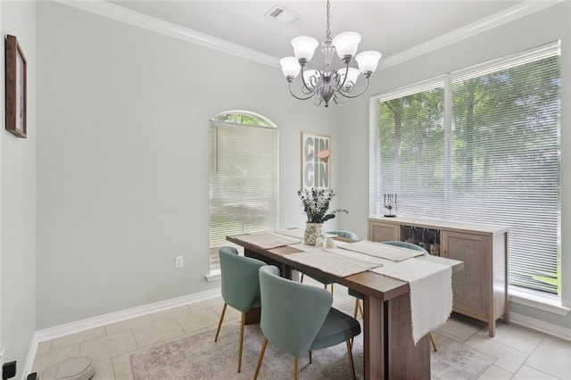 23284 Burvant St, Abita Springs, LA 70420 - dining space with a chandelier, ornamental molding, baseboards, and light tile patterned floors
