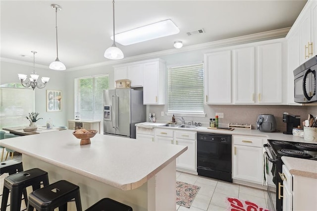 kitchen with visible vents, crown molding, a center island, a sink, and black appliances