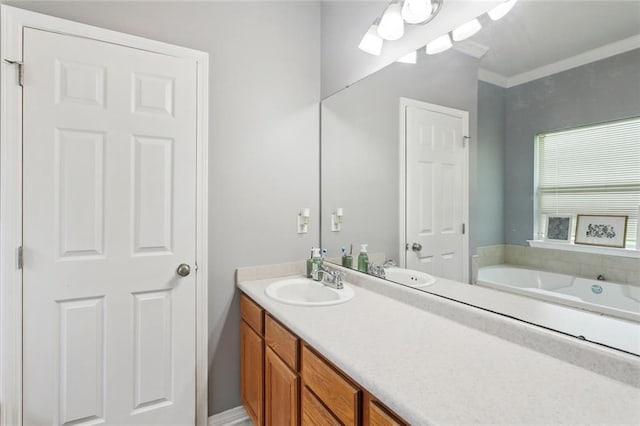 bathroom with vanity and a bath