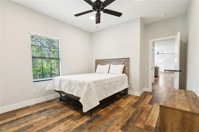bedroom with baseboards, recessed lighting, a ceiling fan, and wood finished floors