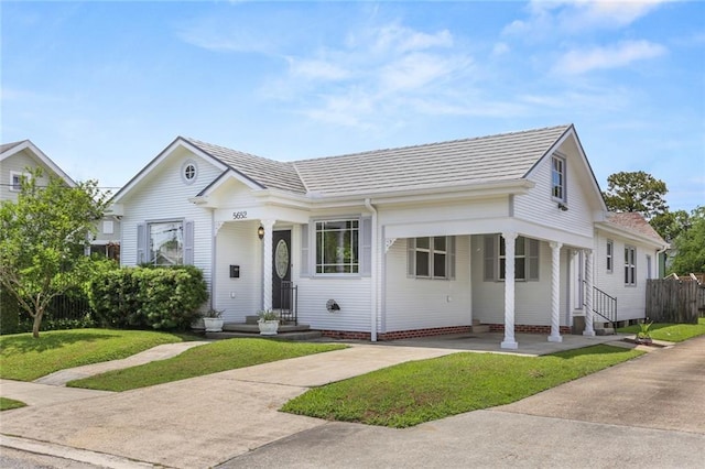 5652 General Haig St, New Orleans, LA 70124 - view of front of home with a carport, concrete driveway, and a front yard