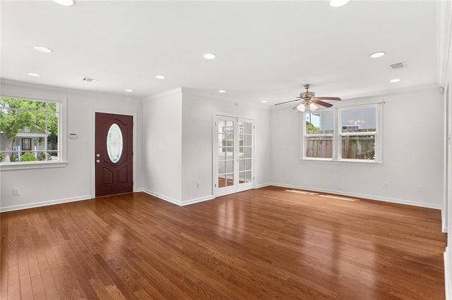 5652 General Haig St, New Orleans, LA 70124 - entrance foyer featuring visible vents, crown molding, wood finished floors, baseboards, and a ceiling fan