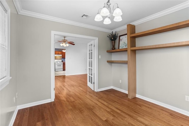 5652 General Haig St, New Orleans, LA 70124 - unfurnished dining area with visible vents, wood finished floors, baseboards, ceiling fan with notable chandelier, and ornamental molding