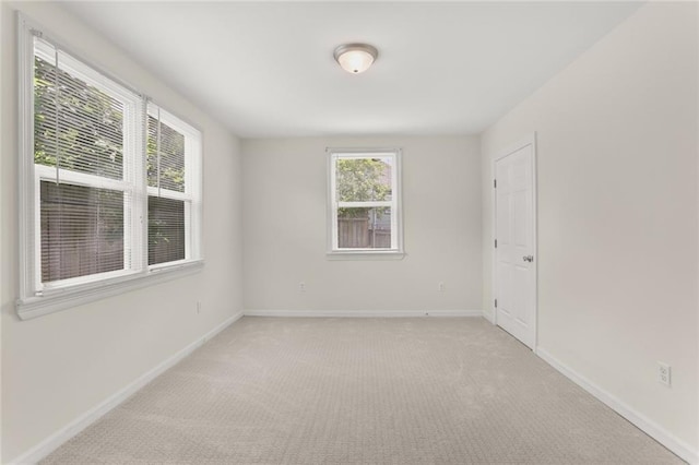 5652 General Haig St, New Orleans, LA 70124 - unfurnished room with baseboards and light carpet