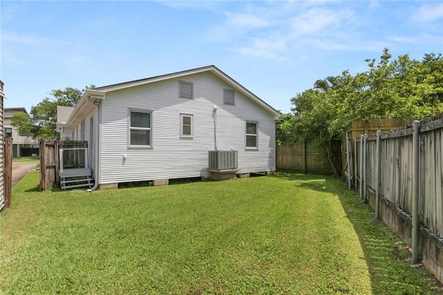 5652 General Haig St, New Orleans, LA 70124 - rear view of property with a fenced backyard, central air condition unit, and a yard
