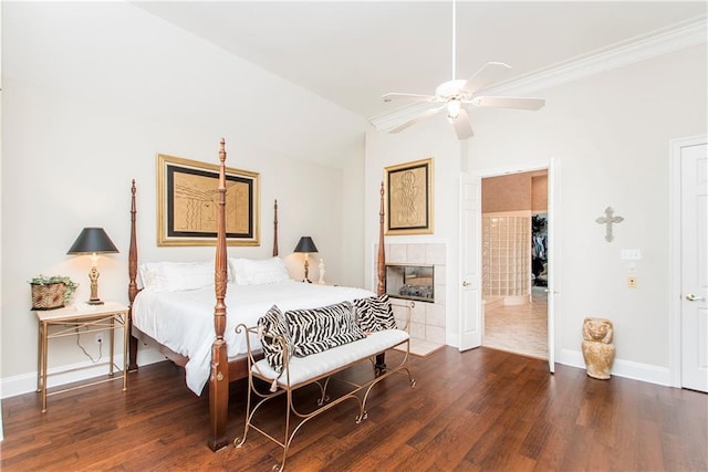bedroom featuring wood finished floors, baseboards, a tile fireplace, a ceiling fan, and ornamental molding