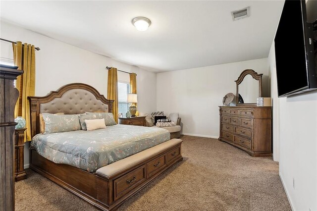 bedroom featuring baseboards, carpet, and visible vents