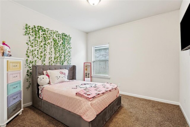 bedroom with baseboards and dark carpet
