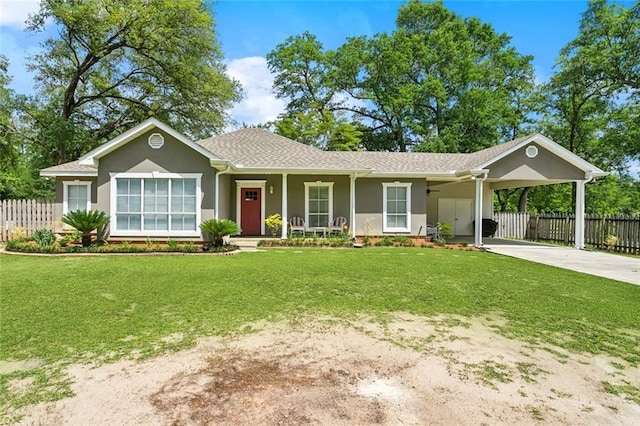 ranch-style home featuring a carport, fence, a front yard, and concrete driveway