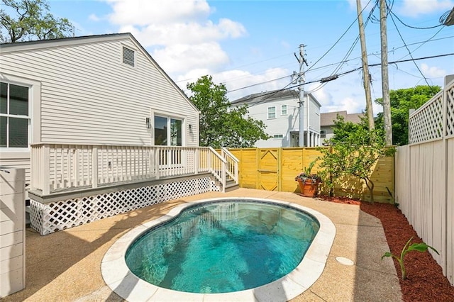 5700 Annunciation St, New Orleans, LA 70115 - view of swimming pool with a deck and a fenced backyard