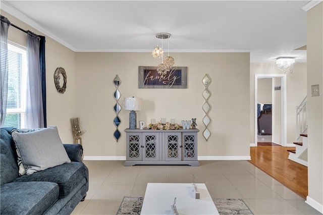 809 Oakwood Dr, Terrytown, LA 70056 - living room featuring crown molding, stairs, light tile patterned floors, and a notable chandelier