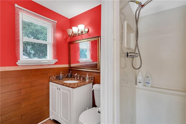 809 Oakwood Dr, Terrytown, LA 70056 - bathroom featuring vanity, wainscoting, a shower, toilet, and wooden walls