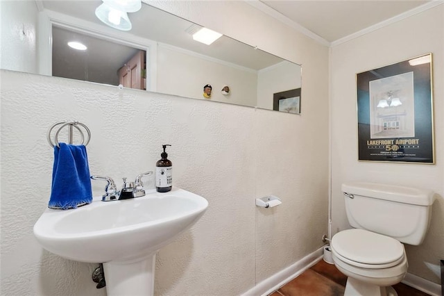 8004 Breakwater Dr, New Orleans, LA 70124 - half bath with crown molding, baseboards, toilet, and a sink